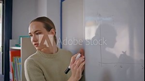 School teacher solving math problems whiteboard closeup. Woman drawing diagrams
