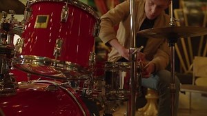 clip-1027452578-drummer-tightening-drumhead-nightclub--provo-utah