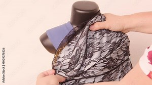 seamstress or designer adjusts fabric on mannequin, showing detailed work and design skills, fashion industry, sewing workshop