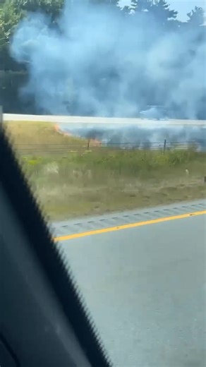 Likely started from a cigarette butt flicked out of a car window. "Brush fire on Route 140 northbound." Video by Helder Dos Santos. | New Bedford Guide