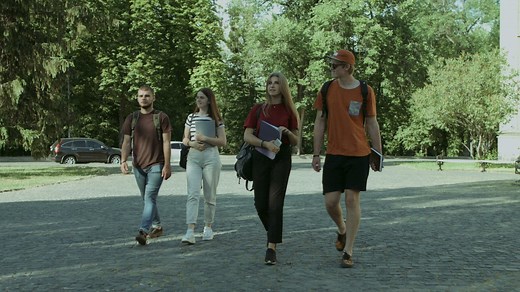 Students walking through a college - Free Stock Video