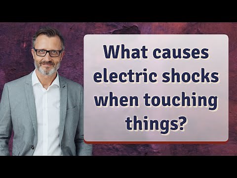 What causes electric shocks when touching things?