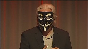 Assange dons mask ahead of extradition ruling