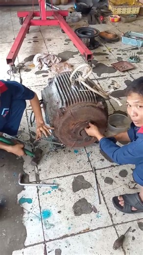 Skilled Worker Cutting Motor Coils – Precision in Electric Motor Repair#cleanenergy