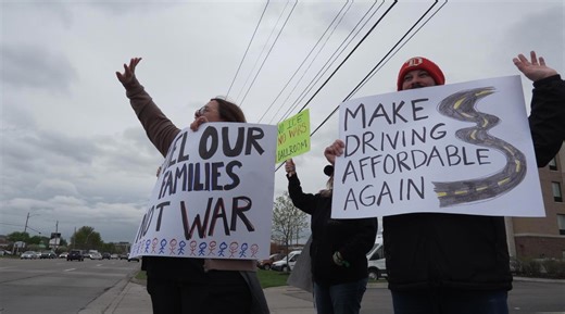 Michigan residents upset with soaring prices at the pump protest at gas station