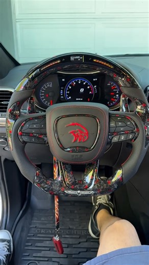 Salam Gorou on Instagram: "No quality & attention to detail comes close 💯 Full custom trackhawk O-E-M steering wheel finished & installed for @joe_2rs 🔥 📍 Round top flat bottom shape 📍 Red forged Carbon top & bottom 📍 Red forged Carbon buttons trim & bottom cover 📍 Red forged carbon extended paddles w white -/+ 📍Red forged Carbon large thumb inserts 📍 Black perforated sides 📍 Red stitching 📍 Premium LED shift light 🚥 📍 Heat function full circle 🔥 📍 Bottom trim metal trackhawk 🦅 ——