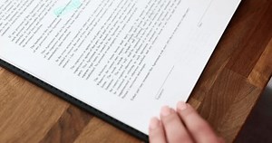 clip-3477295263-inspector-hand-putting-green-stamp-approval-on