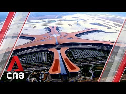 Inside Beijing's new "starfish" airport - and the first commercial flight to take off from there