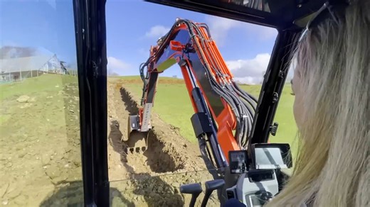 Digging long trenches on a farm this spring