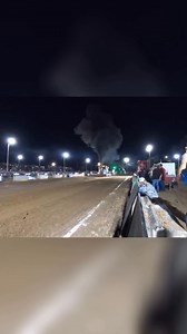 This tractor pulling a heavy load is making some serious horsepower! People are on the sidelines recording the incredible feat. Thanks for watching and enjoy the show. #TractorPull #Horsepower #Farming #Motorsports #HeavyEquipment | Dauminique Fisher