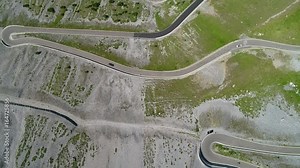 Aerial 4K - Stelvio National Park - Valle del Braulio - Vista della strada e tornanti salendo da Bormio