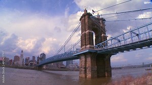 A bridge over the Ohio River leads to Cincinnati Ohio in time lapse.