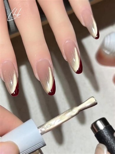 Luvher Beauty Professional Nail Gel | Festive & elegant, with simple steps! ✨🧧 Sheer nude base + gold cat eye effect + ruby red French tip + glossy finish Perfect for holiday... | Instagram