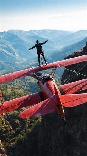 Standing on the wing of an airplane in flight