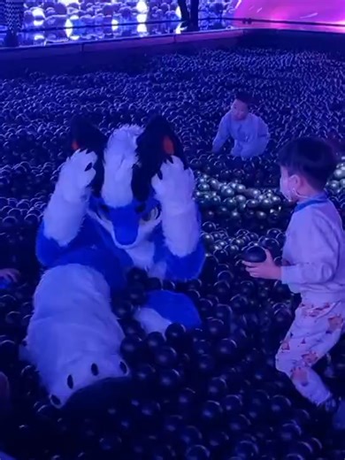 A dragon-humanoid pet, playing in a swimming pool filled with plastic balls, is surrounded and attacked by a group of children.跳进充满海洋球的泳池里玩耍被一群小孩围攻的龙兽人宠物#furry #fursuit #plush #quadsuit #fursona #satisfyingvideo #toy #funny #cute #ornaments #dog #creative #pet #foryourpage #fyp #tiktok #tiktokmademebuyit #cat #viral #laugh