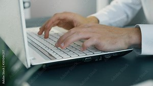 Man hand typing on keyboard laptop. Businessman work in office. Close up 4k slow motion footage.