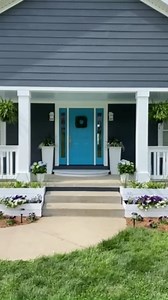 Transforming the front of my porch with new columns, railings, and landscaping added SO MUCH curb appeal! #curbappeal #porchrailing #frontporchmakeover #frontporch | Chica and Jo