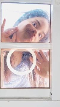 Girl squishing face against the glass 5