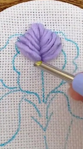 weaving thread on white canvas cloth that is knitted using a special needle