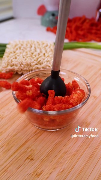 I tried making flaming hot cheetos ramen 🔥🔥🔥🍜🍜🍜 ✨ Recipe: 2 cups FLAMIN’ HOT Cheetos, crushed 4 pkgs (each 2 ¼ oz) instant ramen noodles with seasoning 2 tbsp sesame oil 2 tbsp sriracha hot sauce 4 hard- or soft-boiled eggs, halved 4 scallions, thinly sliced 4 tsp black sesame seeds Directions: 1. Prepare in a sauce pan according to package directions. 2. In large bowl, combine 1 cup FLAMIN’ HOT Cheetos, ramen noodles, ramen seasoning, water volume according to package directions, sesame o