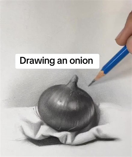 Realistic Onion Drawing with Drapery 🍃🧅 Step-by-step pencil shading using HB pencil, blending brush & Tombow eraser 🎨✏️ A simple object… but full of beautiful textures and light reflections 😍🔥 If you want to learn realistic drawing, shading techniques, texture creation, and highlight control, this reel is perfect for you. The secret of realism is simple: 👉 Observe carefully 👉 Build clean tonal values 👉 Add controlled highlights 👉 Layer slowly 👉 And be patient 🧘‍♂️ In this reel, I’m sh