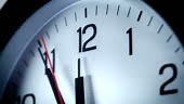 Timelapsed footage of a clock reaching 12 o'clock, cropped from the...