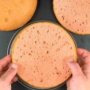 Peek inside to reveal this tasty cake's hidden secret... 🎂 😮 RECIPE: https://bit.ly/2NyQhCP | Scrumdiddlyumptious