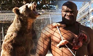 Wildin': Bob Sapp Participates In A Feat Of Strength With A Bear During A Japanese Show!