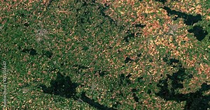 Very high-altitude overflight aerial of lakes, rivers, farmland, Lower Normandy, France. Clip loops and is reversible. Elements of this image furnished by NASA