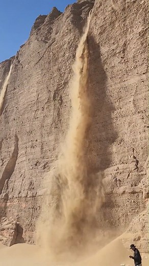 2.2K views · 45 reactions | Have you ever seen Quicksand Falls? Recently, a reporter from CCTV captured a rare quicksand waterfall in the Grand Canyon of Lop Nor in #Xinjiang. It is reported that such phenomenon is seen for the first time!  | T-Time HK | Facebook