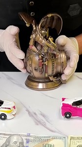 Dragon sculpture with a clock in its stomach | Stacy Wind