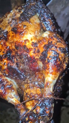 Roasted chicken over open fire 🥵 #music #80smusic #cookingvideo