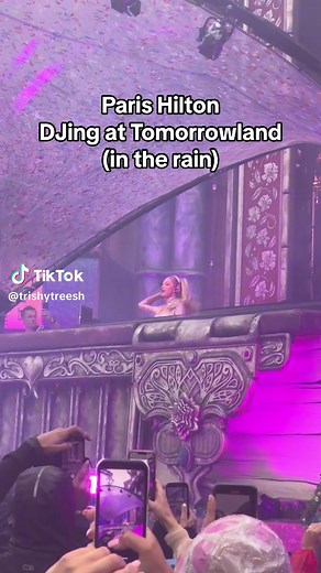 Paris Hilton DJing at Tomorrowland in the Rain