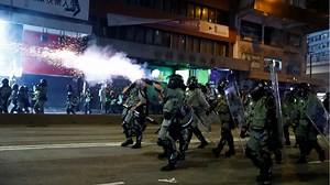 Hong Kong chaos sees tear gas, attack on Chinese news agency