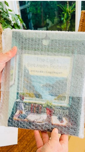 17K views · 63 reactions | ✨Today I unboxed the very first copy of “The Light Between Rooms” — my signed first edition art book. Seeing it in print for the first time was a little surreal! Preorders open this Thursday! I can’t wait to share more of what’s inside in another few days… #artbook #artistlife #collectorsedition #bookreveal | Richard Claremont | Facebook