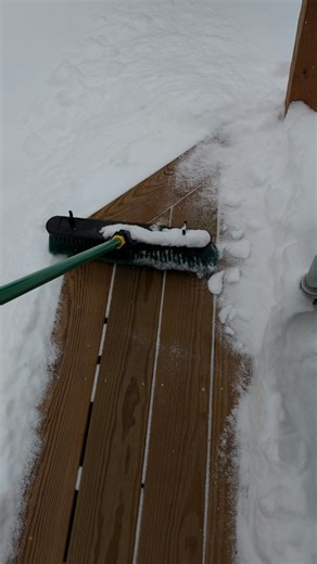 I’m using one hand to demonstrate how easy it is to get the snow off the deck… Of course, it helps when the snow is light and powdery. If it is wet, you have to sweep it often. It can still be done with a hand broom or push broom. | Jack Julius