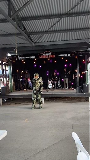 Halo 4 Master Chief costume with band playing Halo theme