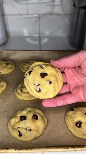 Chocolate chip cookies. In a large mixing bowl, add 1 cup (2 sticks) softened butter, 1 cup sugar, and 1 cup packed brown sugar. Stir until fully combined. Once combined, add 2 eggs - making sure to add 1 egg at a time and mixing between each add. After the eggs are added, add 2 tsp vanilla extract, 1 tsp baking soda, and 1/2 tsp salt. Mix. Add 3 cups all purpose flour. Once fully combined, add 2 cups semisweet chocolate chips. And like before, mix again. Place cookie dough on a baking sheet and