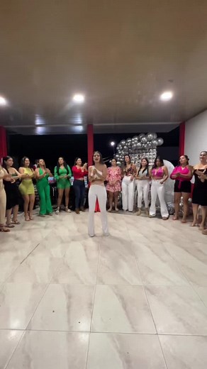 Coordinated Dance Routine by Women in Colorful Outfits