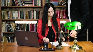 A judge or lawyer signs a legal agreement or contract at his workplace. Concept of transaction, contract and legal agreements.