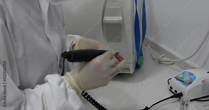 Dental prosthesis, dentures, prosthetics work. Restoration concept. Close up view: professional dental technician or dentist hands holding motor handpiece tool and working with dental prosthesis Stock Video