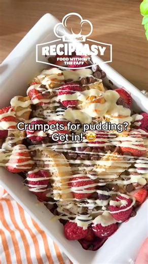 This Summer Crumpet Bake combines chocolate and those glorious circles of happiness we call crumpets to make the most banging afters of the season. ​ Give it a try and see what you think 👇 ​ 🔥 Preheat your oven to 180 degrees ​ 💛 Slice your crumpets in half and pop them in a dish with a spritz of oil-spray 🥚 Whisk up eggs, milk, vanilla essence, and honey and pour all over your crumpets, getting right in those holes ​ 🍓 Top with whatever berries you fancy and a solid handful of choccy chips