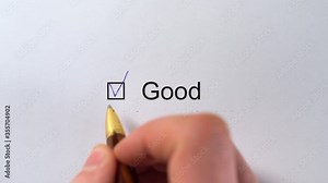 Good - Customer Service Evaluation Form. Assessment checkbox marking with the inscription GOOD. Raiting Survey. Good - male hand pointing a tick in the checkbox on white paper with pen