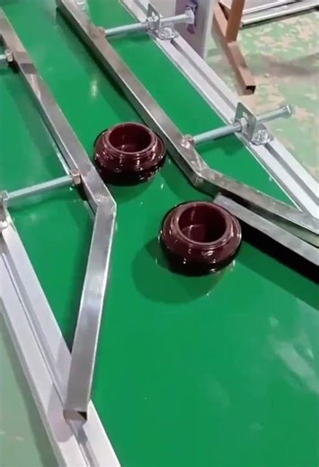 Automatic Capping Machine Efficiently Sealing Plastic Jars on a Conveyor Belt"