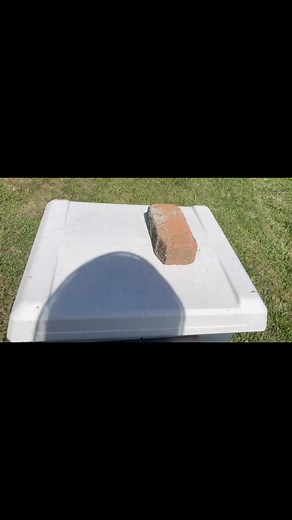 Adding feed bags onto the hives using empty candy boards as shims. | BLIND BEE HONEY
