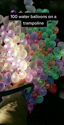 Trampoline Balloon Launch Fun in the Summer Sun
