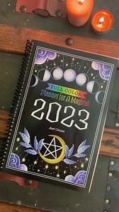 Full Color Planner for a Magical 2023 in SPIRAL BOUND just popped up on the “Big A” online retailer! This book is filled with magic, practical moon spells, awesome rituals, calendars, planner pages, and it’s gorgeous! xox #moonmagic #witchcraftforbeginners #witches #witchyvibes #witchywoman #mooncalendar #moonphases #witchcraftsupplies #moonphases | Coloring Book of Shadows
