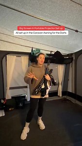 Setting up the big screen & portable projector for the darts semi-finals and finals 🎯 All bought from the TikTok Shop for an absolute bargain 🙌 Bonus: it makes the BEST movie nights for the kids while we’re away 🍿✨ #caravanlife #portableprojector #campingsetup #moviesetup #touringcaravan | TouringwithRiva