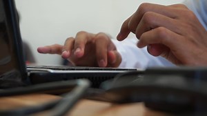 Man hand typing on a laptop keyboard. Businessman hands busy working on laptop. student professional study work with pc software technology concept.