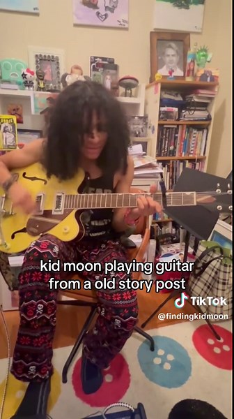 Kid Moon Playing Guitar: A Nostalgic Musical Journey